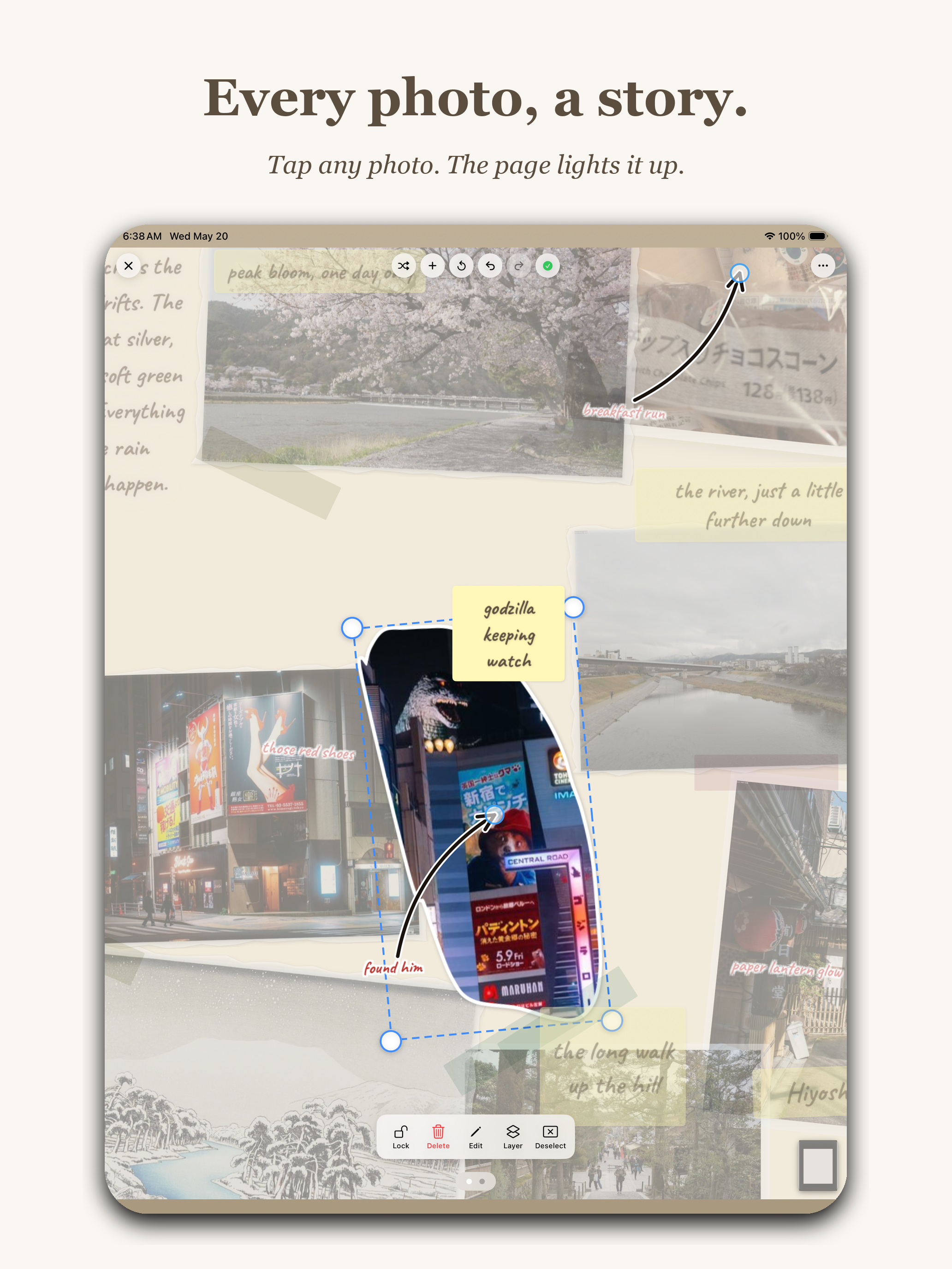 App Store marketing screenshot with headline Every photo, a story. and subtitle Tap any photo. The page lights it up. Shows an iPad with a single Polaroid photo of a Godzilla figure on a Tokyo street pulled forward from a dimmed scrapbook page. The selected photo has cyan transform handles around it, a sticky-note label reading godzilla keeping watch, and a small arrow drawing pointing to it with the text found him.